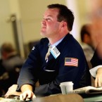 Traders work on the floor of the New York Stock Exchange on Oct. 23: Dow companies are being dragged down by slowing economic growth in China.&nbsp;