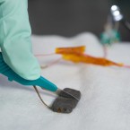 A researcher slices into a small piece of this newly developed self-healing material, which can supposedly repair itself within 30 minutes.