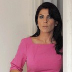 Jill Kelley leaves her home on Nov. 13: Kelley and her husband, a doctor, apparently bankrupted their cancer charity after less than a year.