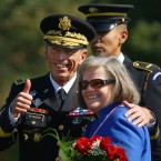 Happier times: David Petraeus, with his wife Holly, gives a thumbs up during an Armed Forces Farewell Tribute and Retirement Ceremony on Aug. 31, 2011, in Ft. Myer, Virginia.