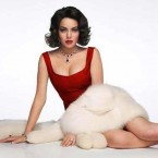 Lindsay Lohan portrays Elizabeth Taylor "as a childish brat, like a teenager playing dress-up in her mother's furs and jewels,"&nbsp;says Jill O'Rourke at&nbsp;Crushable.