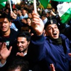 Palestinians celebrate the U.N.'s upgrade on Thursday of the Palestinian Authority's status to non-member state.