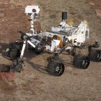 Three generations of Mars rovers, including an early version of Curiosity (right).