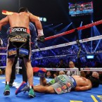 Manny Pacquiao lays face down on the mat after being knocked out in the sixth round by Juan Manuel Marquez on Dec. 8.