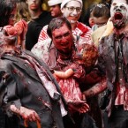 Men dressed as zombies walk through the central business district during the Sydney Zombie Walk on Oct. 24.