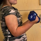 A girl lifts weights during the 2010 Shapedown program for overweight adolescents and children in Colorado.