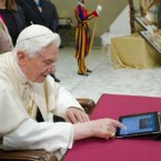Let us input: Pope Benedict XVI uses a tablet to compose his first tweet ever.