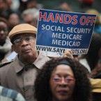 Demonstrators, including many senior citizens, protest against cuts to federal safety net programs.