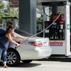 Californians pump gas: A drop in gas prices eased some of the strain on household budgets in November.