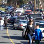 Parents pick up their children near Sandy Hook Elementary School in Newtown, Conn., after Friday's deadly shooting.