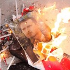 Pictures of Syrian President Bashar al-Assad and Syrian flags burn on the streets of Aleppo on Dec. 17.