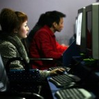 People surf the internet at a cyber cafe in Chongqing Municipality, China.