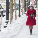 A pedestrian walks down Main Street in Greenfield, Mass., on Dec. 27 when an earlier storm hit the region before this weekend's snowfall.