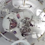 An astronaut about to exit the International Space Station for a spacewalk: Watch out for radioactive particles!