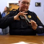 Lt. Ray Mesek registers a pistol at a gun buyback event at the Bridgeport Police Department in Connecticut on Dec. 22.
