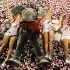 The mascot and cheerleaders of the Alabama Crimson Tide celebrate after defeating Notre Dame 42-14 to win the BCS championship.