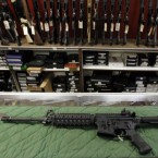 An AR-15 style rifle is displayed at the Firing-Line indoor range and gun shop in Aurora, Colo.