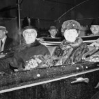 President and First Lady Roosevelt brave the wretched weather in an open-air limo during the inaugural parade in 1937.