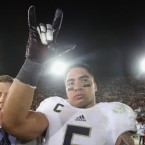 Linebacker Manti Te'o of Notre Dame celebrates a Nov. 24 victory, two months after his fake girlfriend died.