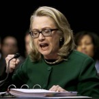 Secretary of State Hillary Clinton pounds her fist as she testifies on Capitol Hill.